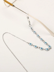 Detail of silver glasses chain with evil eye beads and clear silicone loop connectors