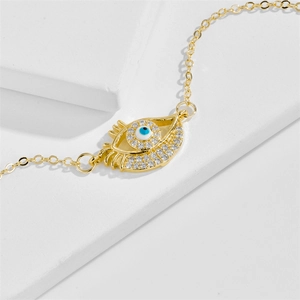 Gold evil eye necklace with white zircon pavé and blue mother of pearl inlay on stone