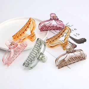 Detailed flat lay of translucent acrylic hair claws in six vibrant spring colors