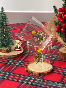 Detail view of 3D Christmas tree inside transparent borosilicate glass cup with star