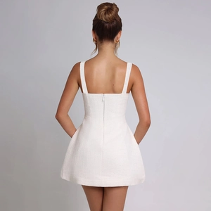 Elegant white tweed sleeveless mini dress featuring a fitted back with invisible zipper closure