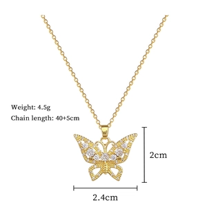 Detailed view of hollow butterfly pendant with zircon inlay and product dimensions