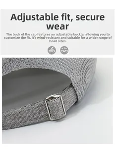 Détail de la casquette grise avec boucle métallique réglable pour un maintien sûr