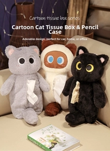 Three cute plush cat tissue boxes in grey, beige, and black on a cozy home sofa