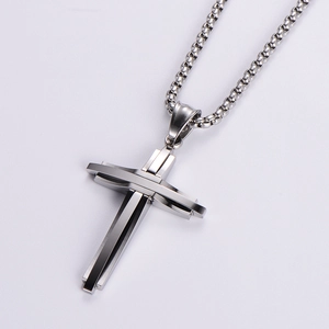 Polished silver stainless steel cross pendant necklace with woven chain on white background