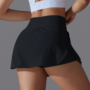 Close-up of high-waist black tennis skort showing pleated back detail and athletic fit