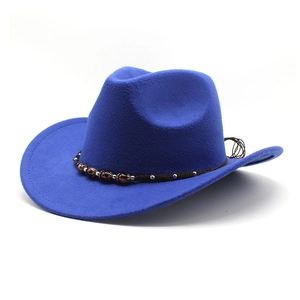 Close-up of royal blue wool western cowboy hat with beaded braided strap and wide brim