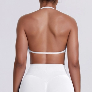Detailed back view of white halter neck sports bra and high waist yoga leggings set