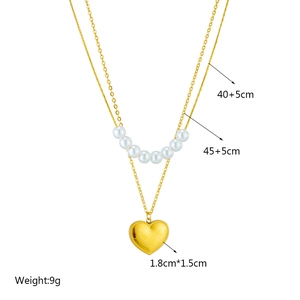 Double-layer gold heart pendant necklace with pearl accents for elegant minimalist style