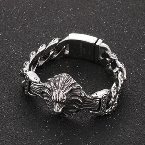 Detail shot of 316L stainless steel wolf head bracelet with rustic cast metal finish