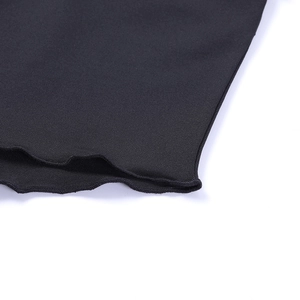 Close-up of black knitted fabric texture and high-quality edge stitching details