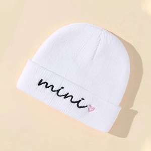 White ribbed knit beanie for kids with mini text and pink heart embroidery