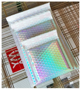 Detail showing holographic laser bubble mailer with adhesive seal on metal grid