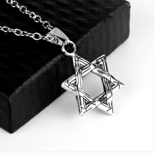 Silver hexagram star pendant necklace on black jewelry box with minimalist long chain