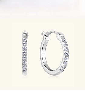 Detailed close-up of S925 sterling silver huggie earrings with brilliant moissanite stones
