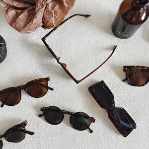 Collection of tortoiseshell sunglasses in cat-eye and square shapes with T-shaped hinges