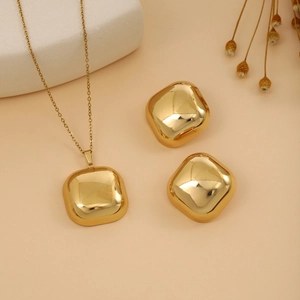 Golden luxury square earring and necklace set with a polished geometric leaf texture finish