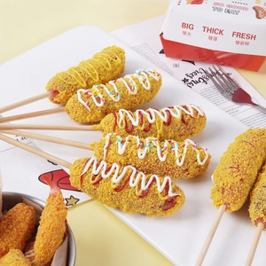 Realistic artificial corn dog props with mustard and ketchup on a white plate