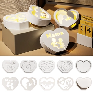 Detail of DIY epoxy resin heart lamps with Mama lettering and warm glowing LED lighting