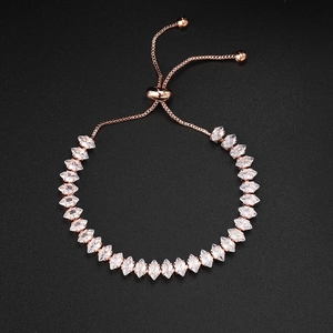 Detail of rose gold tennis bracelet with marquise-cut zircons and adjustable pull chain