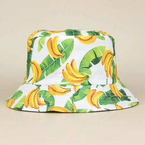 Detail of banana and leaf print on white canvas reversible bucket sun hat for women