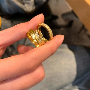 Detail of 18K gold plated irregular wavy ring and classic pavé diamond band