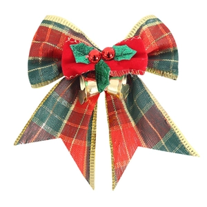 Christmas burlap plaid bow with holly leaves, red berries and golden bells decoration