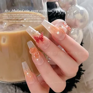 Maillard style brown gradient press-on nails with 3D resin butterfly and flower charms