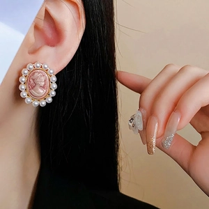 Vintage cameo earrings with portrait engraving and pearl border in gold finish