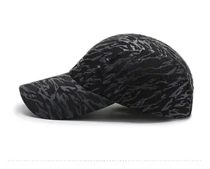Close-up of lightweight breathable camo mesh fabric on black and grey baseball cap