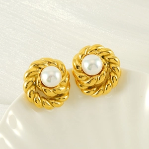 Vintage gold twisted rope earrings with large round pearls and polished finish