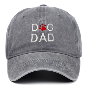 Close-up of DOG DAD embroidery and red paw print on vintage dark grey baseball cap