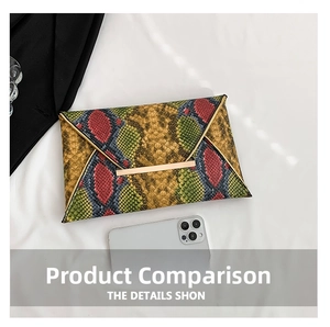 Macro view of colorful snakeskin envelope clutch bag with gold metal trim detailing