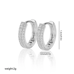 Close-up of silver huggie earrings with triple-row zircon pavé inlay and dimensions