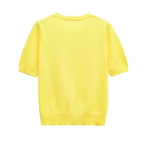 Detail shot of yellow knit texture and round neck stitching on short sleeve summer top