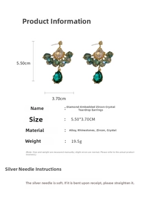 Close-up of green teardrop crystal earrings with rhinestones and S925 silver needles