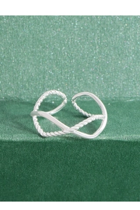 Detailed shot of an adjustable S925 silver infinity ring with twisted rope texture
