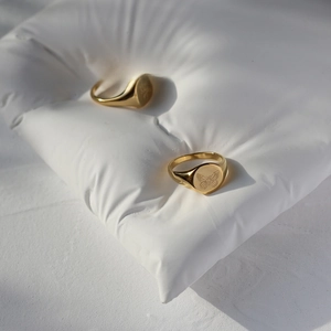 Macro detail of vintage gold butterfly signet ring in 18K gold plated stainless steel