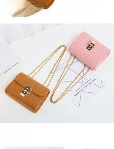Detailed top view of brown and pink teddy plush chain bags with golden hardware