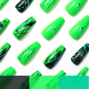 Neon green and black coffin nails with marble patterns and artistic stripe accents
