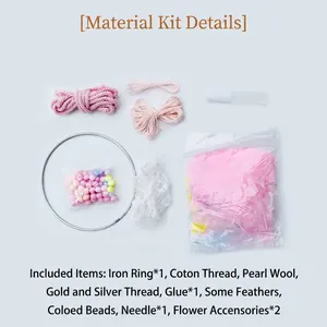 DIY dream catcher craft kit with pink yarn, white feathers, beads and metal ring components