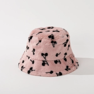 Close-up of pink faux rabbit fur bucket hat with cherry print texture and soft fibers