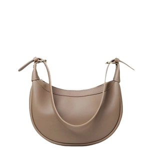 Minimalist brown leather crescent bag with a sleek saddle silhouette for daily commuting