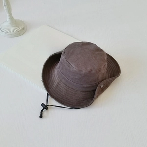 Top view of dark brown wide-brim sun hat with adjustable cord and minimalist decor