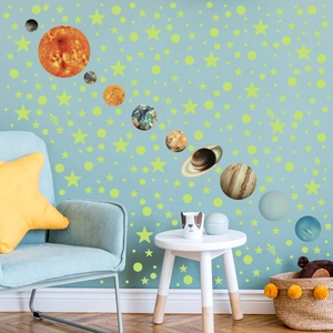Luminous solar system wall stickers featuring 10 planets and stars in a cozy nursery