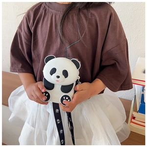 Close-up of a cute panda-shaped silicone kids' crossbody bag held by a child
