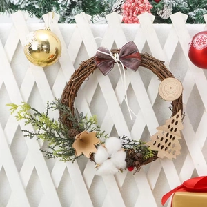 Christmas wreath with natural vines, cotton, and rustic wooden pendants for door decor