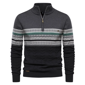 Detail of half-zip sweater showing ethnic jacquard stripes and cable knit texture