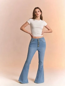 Detail of high waist button fly design on light blue slim fit flared denim jeans