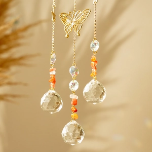 Golden moon wind chime with butterfly charm, crystal prisms and colorful raw gemstones
